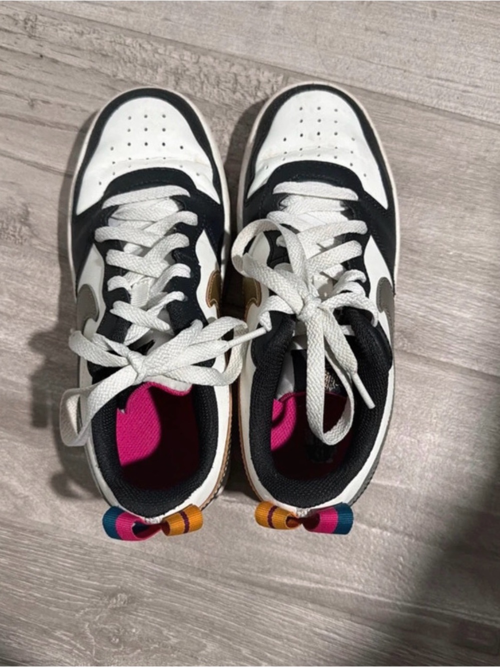 Nike Kids White and Black Sneakers with Pink Lining and Multicolor Heel Tabs
